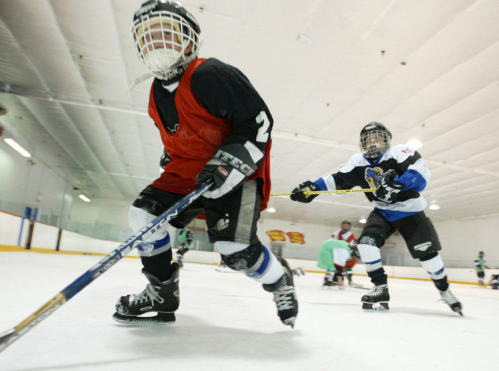 TORONTO OUT Catrholic Elementary School board strike_21/5/03_TG_ Christopher Metcalf of Blessed Sacrement Elementary school races by for the puck during a game at Rinx recreation centre. Vic Casale, a parent of one of the children, organized the event. (Tobin Grimshaw/Toronto Star/Digital image)
